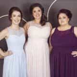 Curvy bridesmaids wearing Kiri dresses in blue, pink and grape