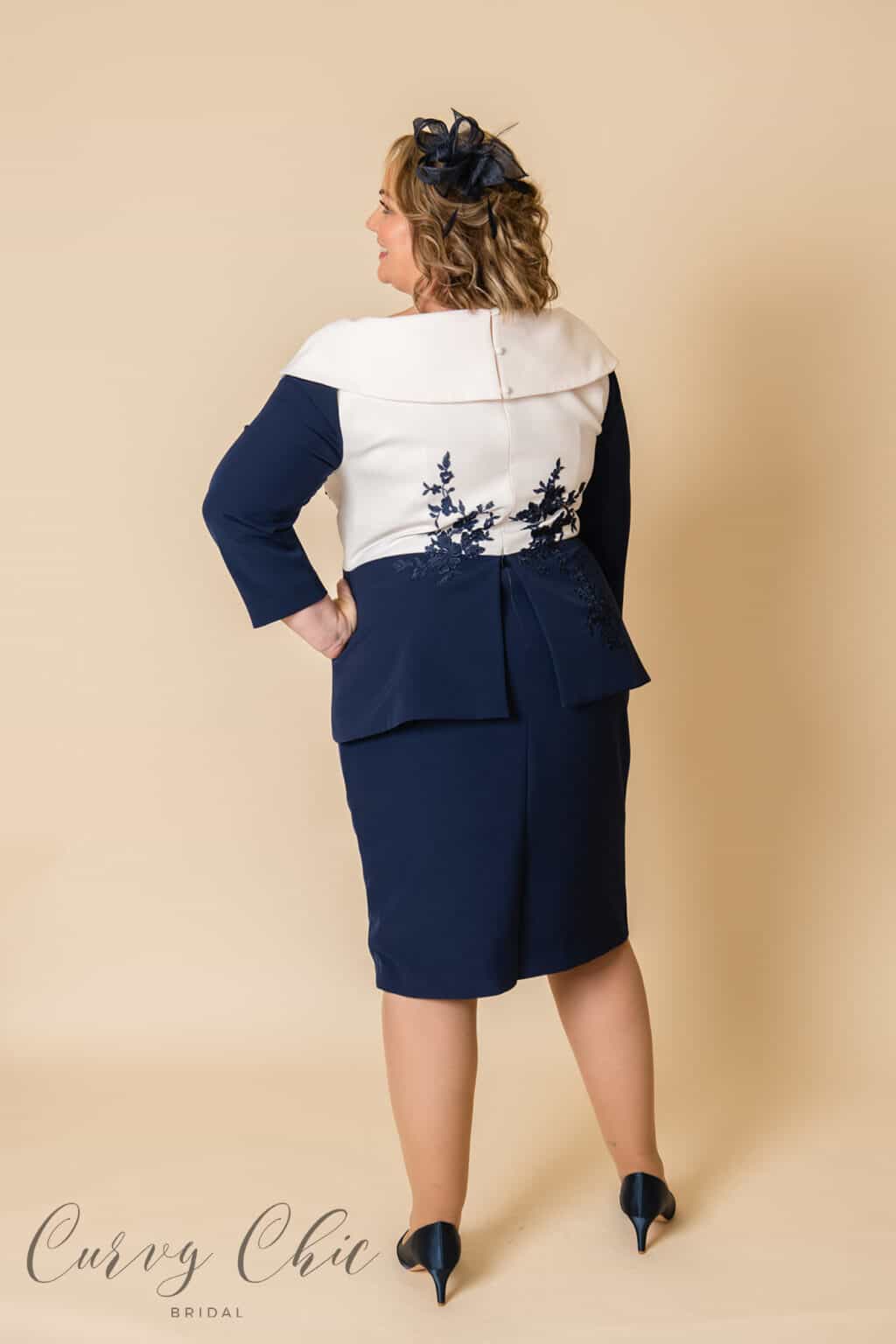 DU4391 Ivory and navy mother of the groom plus size peplum midi dress - back