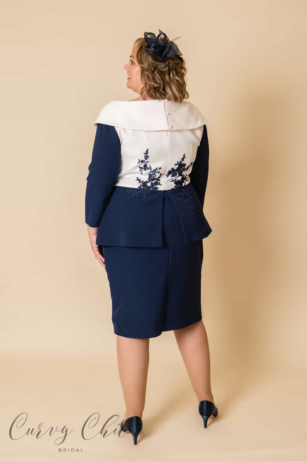 DU4391 Ivory and navy mother of the groom plus size peplum midi dress - back