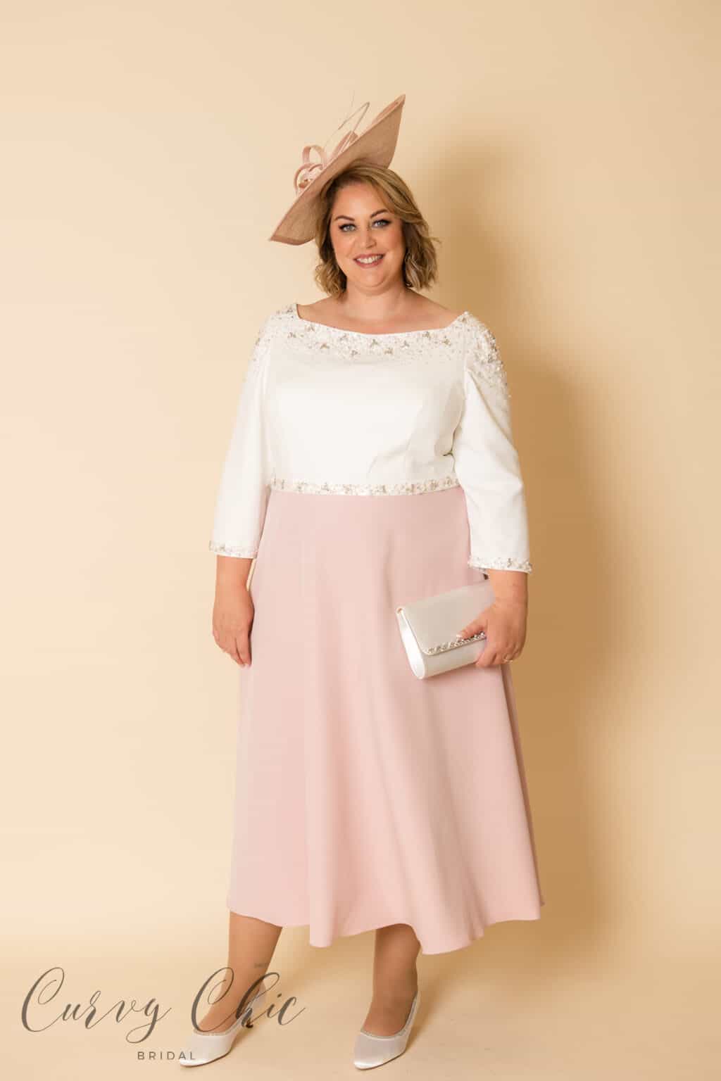 Plus size model wearing Veni Infantino 991930 ivory and vintage rose mother of the bride dress with beaded neckline, Curvy Chic Boutique Belfast