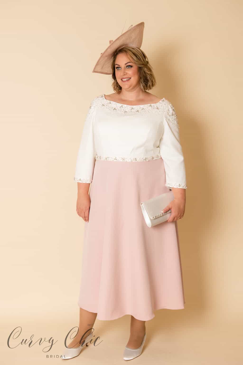 Side angle view of Veni Infantino 991930 ivory and vintage rose A-line plus size mother of the bride dress with beaded waist detail