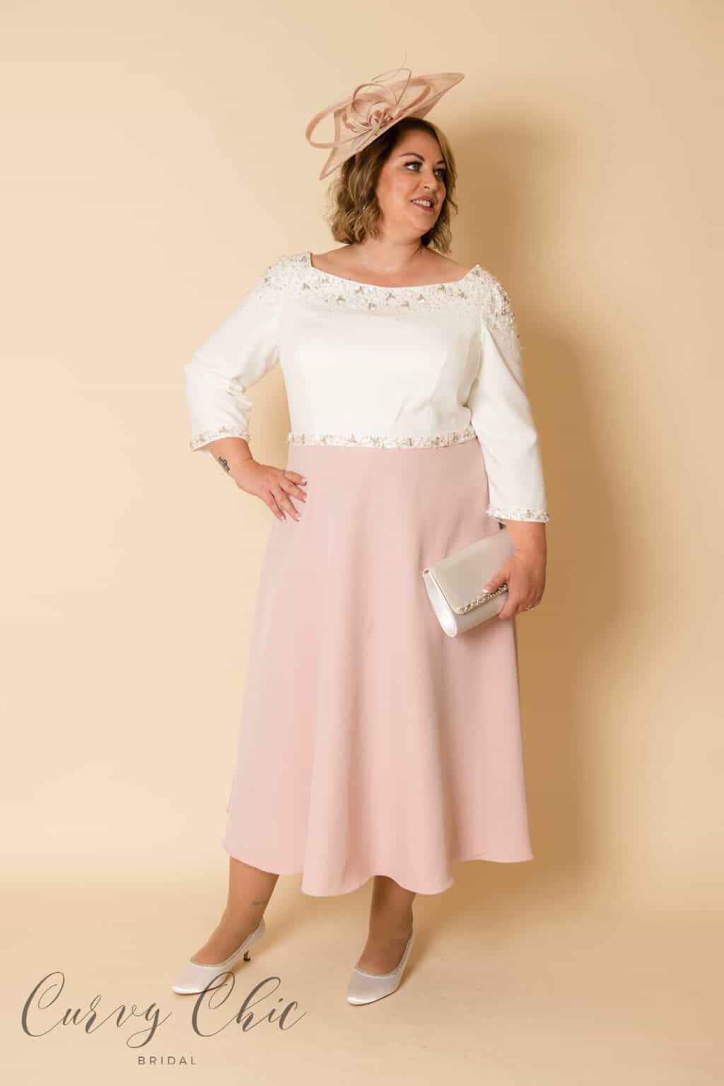 Front view of Veni Infantino plus size mother of the bride dress in ivory and vintage rose with floral bead embellishment
