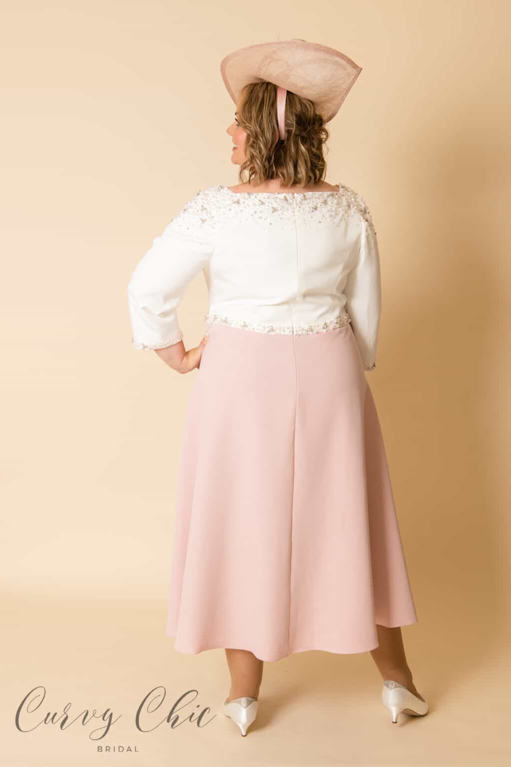 991930-Ivory and Vintage rose plus size mother of the bride groom dress with beading detail-6 Rear view of Veni Infantino 991930 plus size mother of bride dress showing beaded back neckline and A-line vintage rose skirt