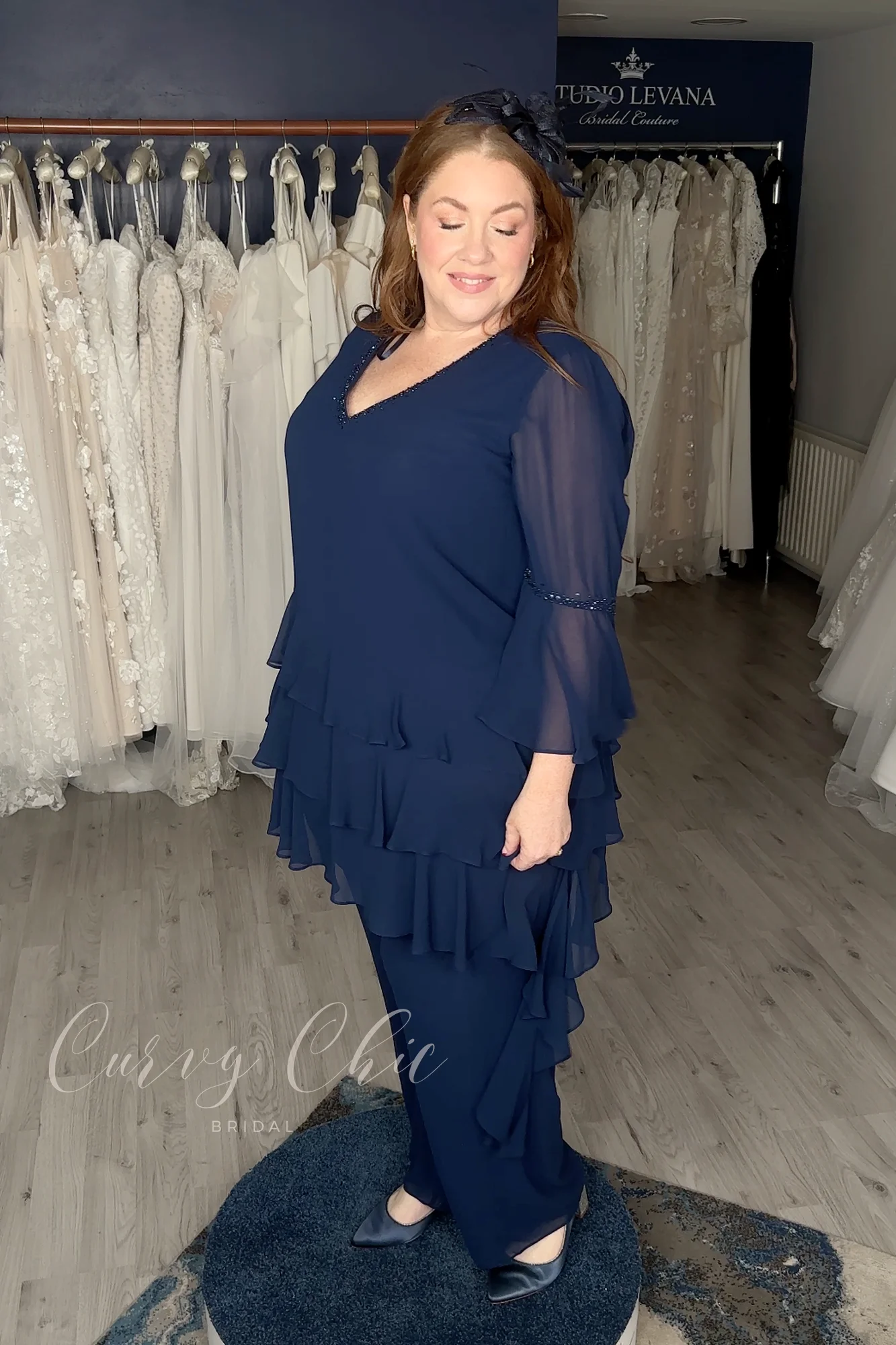 DU679K-1 Plus size navy ruffle trouser suit with bell sleeves by Veromia