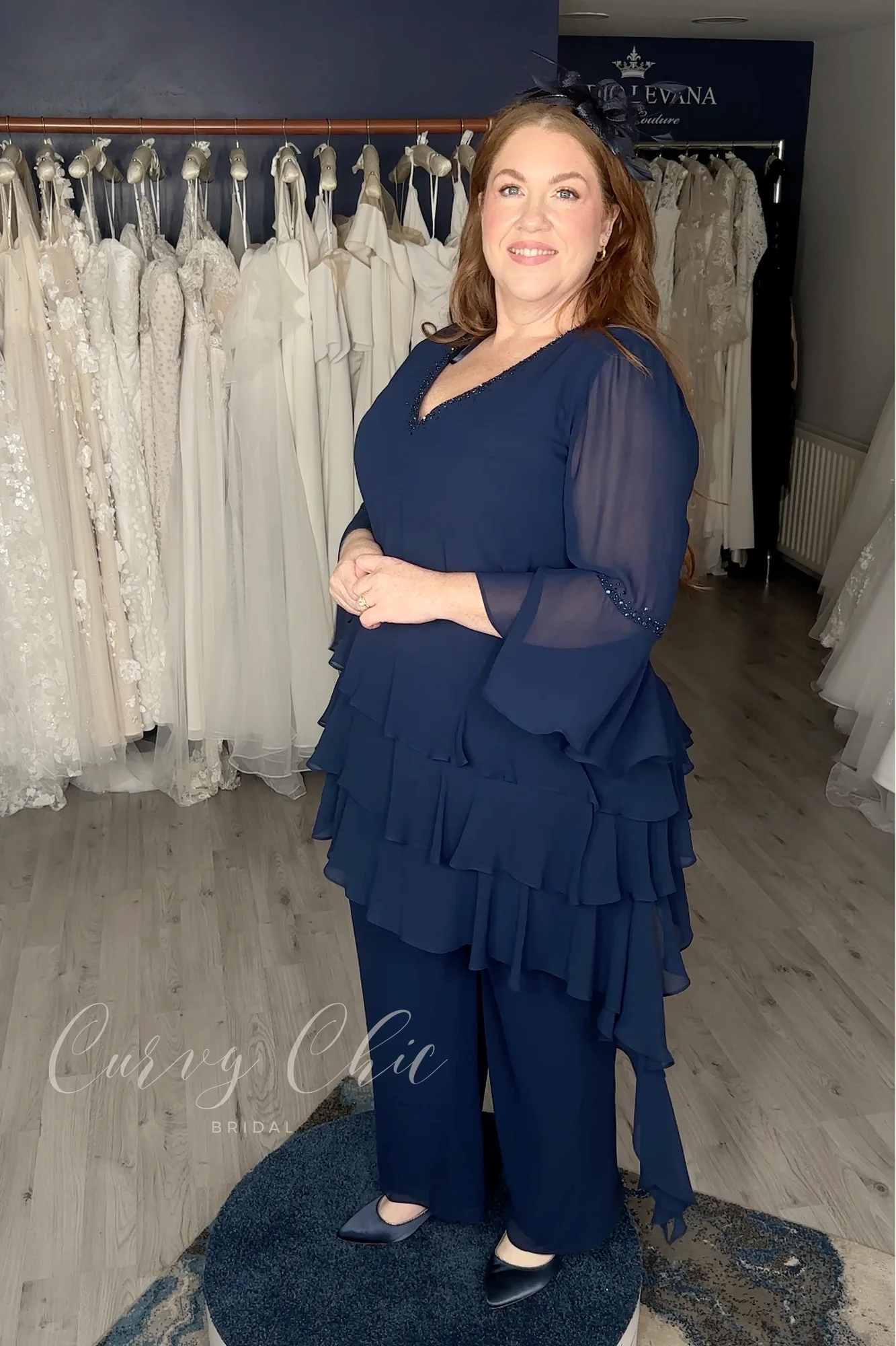 DU679K-2 Plus size navy ruffle trouser suit with bell sleeves by Veromia