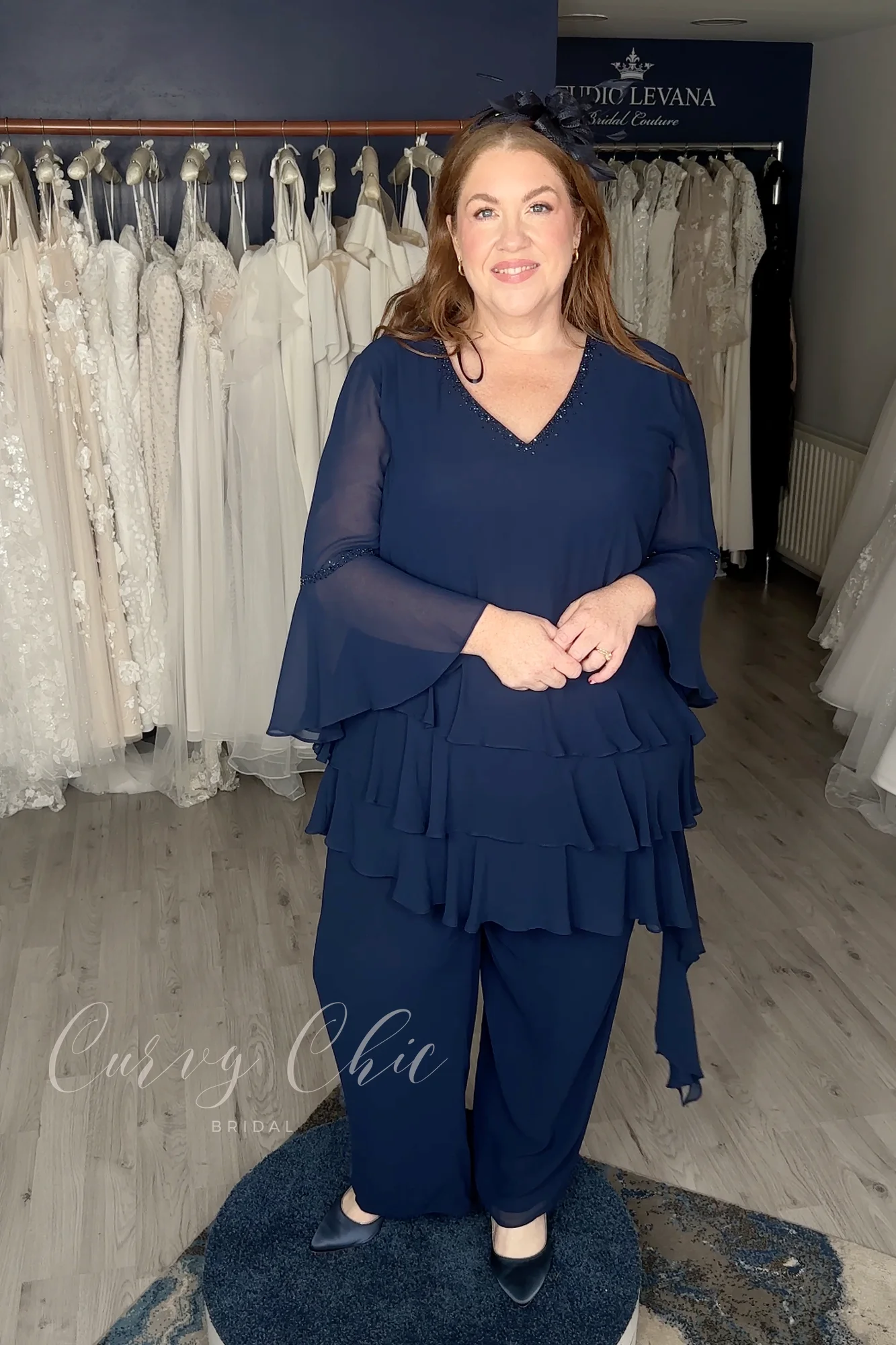 DU679K-3 Plus size navy ruffle trouser suit with bell sleeves by Veromia