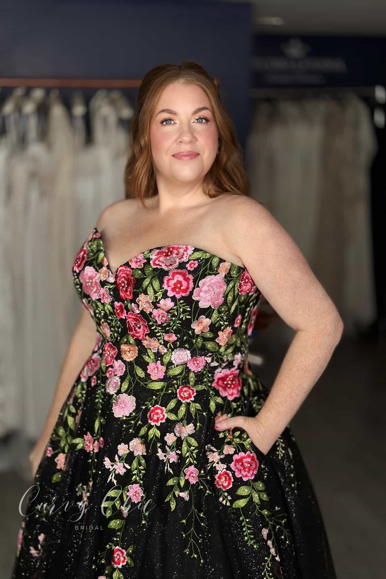 Embroidered floral detail on black plus size bridal gown